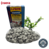 El Sera Siporax Professional 15 mm junto a su empaque original, resaltando su presentación para acuarios de agua dulce y salada